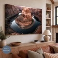 Unframed stretched canvas featuring Horseshoe Bend, with the photograph continuing around the visible canvas edge. Displayed above a wooden sideboard beside pottery and a lamp in a neutral room. Free Shipping badge at lower left.